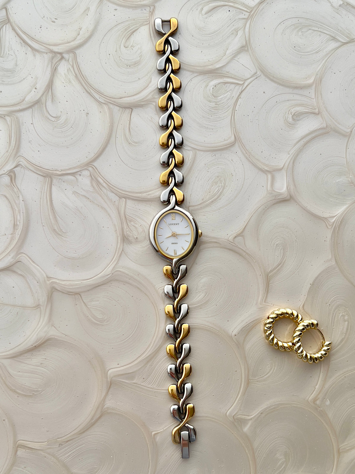 Full-length view of Seiko Lucent women’s watch and two-tone bracelet