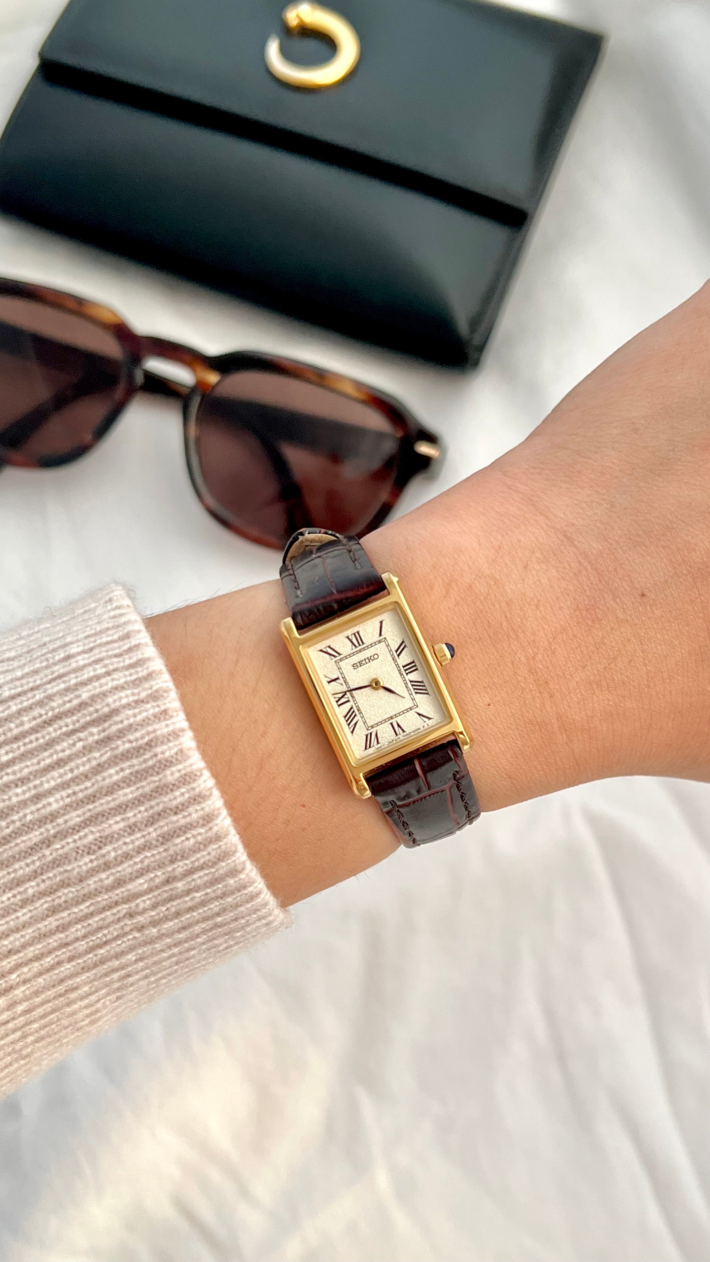 Seiko x Nano Universe rectangular women’s watch styled with sunglasses and gold jewellery