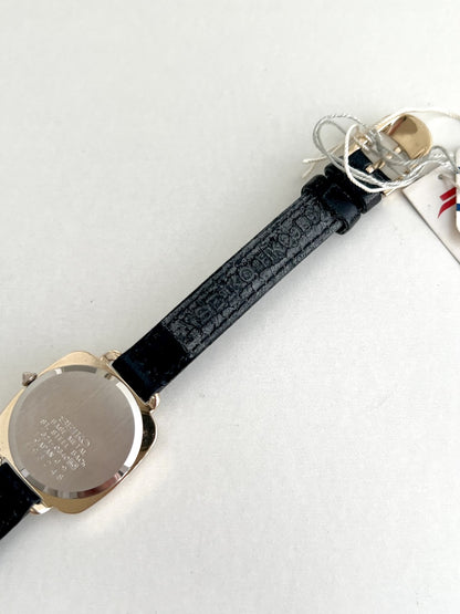 Seiko Nouveau 7321-0340 caseback with serial 593248 and Seiko marking on the leather strap underside.