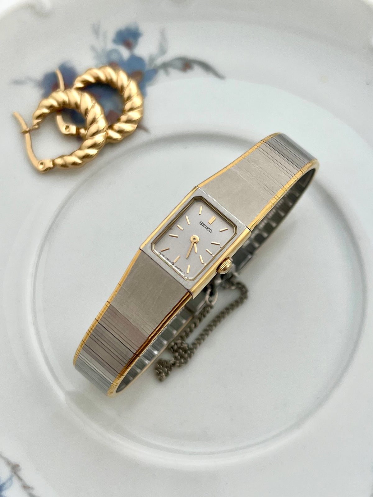 Caseback detail of the Seiko Petite Satin bracelet watch.