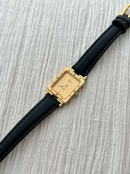 Angled view of the Seiko Porte stepped gold-tone tank case.