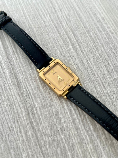 Detail of the Seiko Porte gilded rectangular dial and dauphine hands.