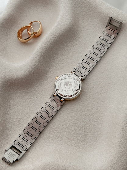 Seiko Presage Roman Bezel Two Tone Women’s Watch featuring silver sunray dial and integrated two tone bracelet; vintage watch product image 4.