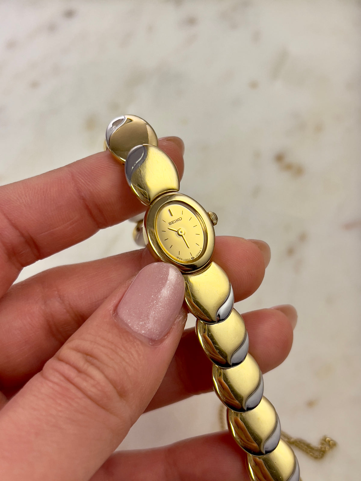 Seiko Tisse Oval Sculpted Two Tone Women's Watch — product photograph 4, Gilded Hour NZ.