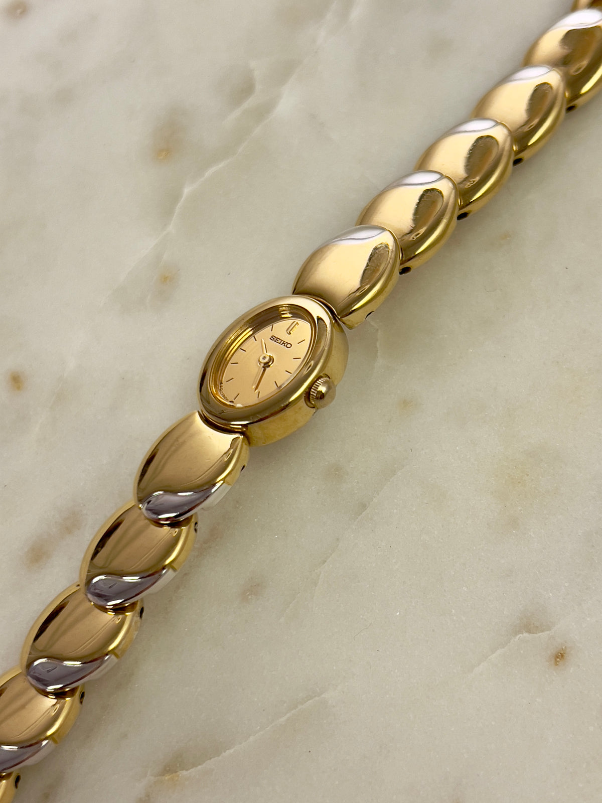 Seiko Tisse Oval Sculpted Two Tone Women's Watch — product photograph 6, Gilded Hour NZ.
