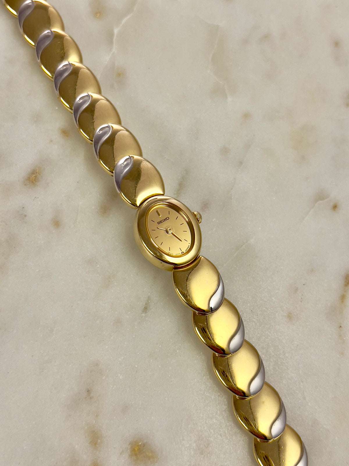 Seiko Tisse Oval Sculpted Two Tone Women's Watch — product photograph 7, Gilded Hour NZ.