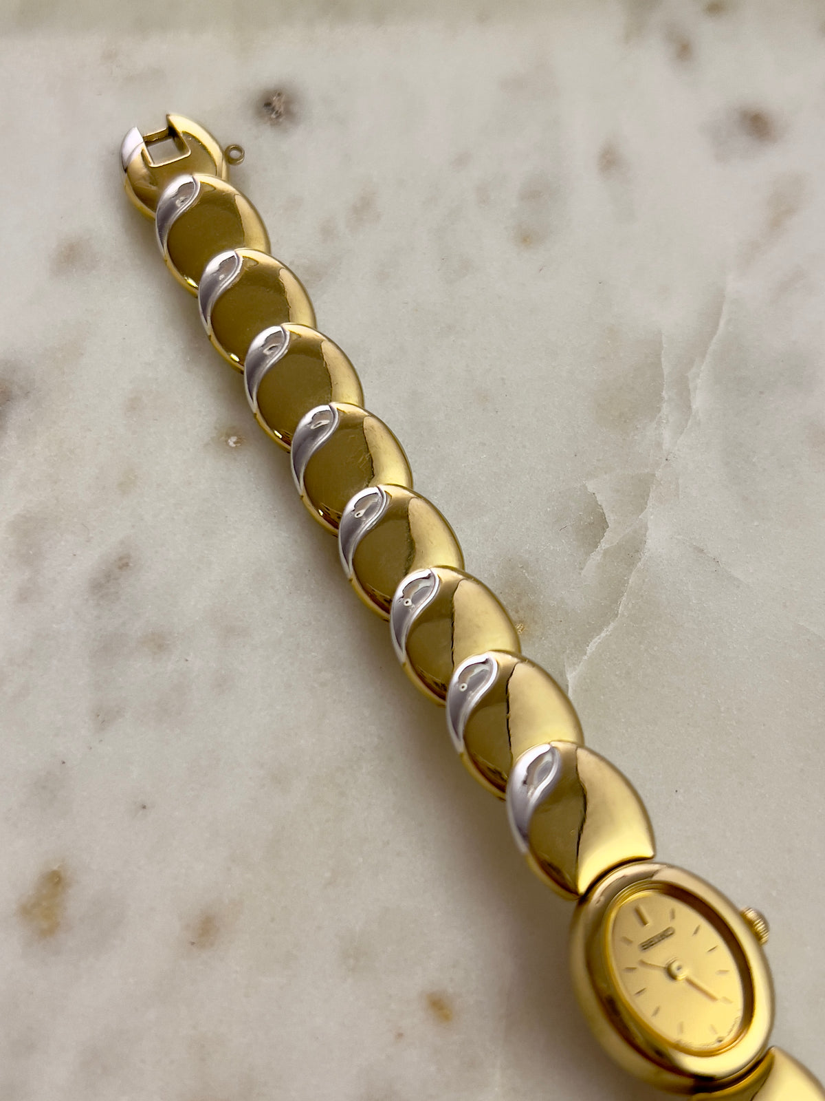 Seiko Tisse Oval Sculpted Two Tone Women's Watch — product photograph 8, Gilded Hour NZ.