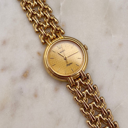 Seiko Belfina Gold Toned Watch with Intricate Bracelet, dial close up of a vintage women's watch at Gilded Hour.