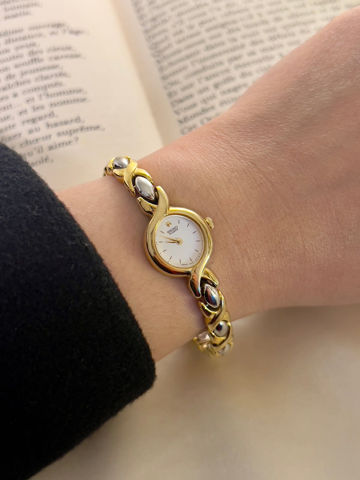 Seiko Oval White Dial Sculpted Two Tone Women's Watch — product photograph 3