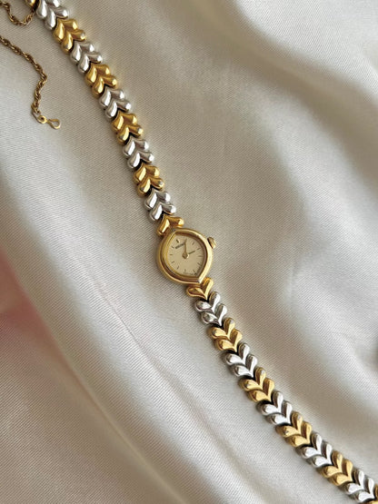 Seiko Champagne Dial Tear Drop Watch with Two-Tone Leaf-Link Bracelet, wrist shot of a vintage women's watch at Gilded Hour.