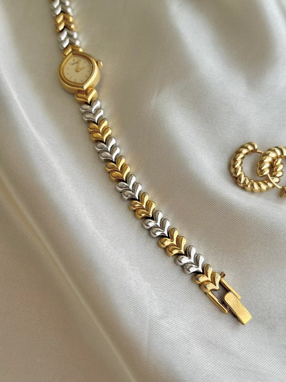 Seiko Champagne Dial Tear Drop Watch with Two-Tone Leaf-Link Bracelet, case profile of a vintage women's watch at Gilded Hour.