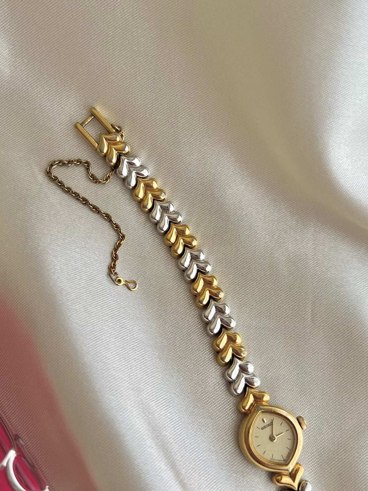 Seiko Champagne Dial Tear Drop Watch with Two-Tone Leaf-Link Bracelet, bracelet detail of a vintage women's watch at Gilded Hour.