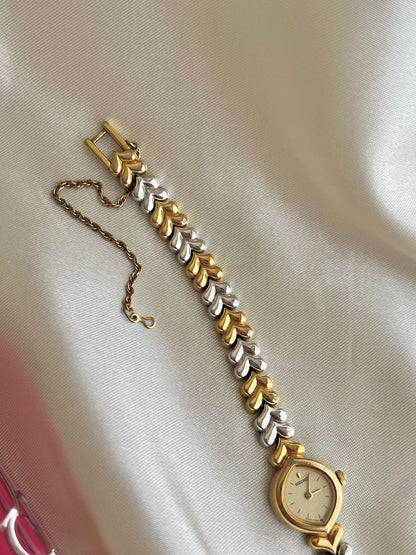 Seiko Champagne Dial Tear Drop Watch with Two-Tone Leaf-Link Bracelet, bracelet detail of a vintage women's watch at Gilded Hour.