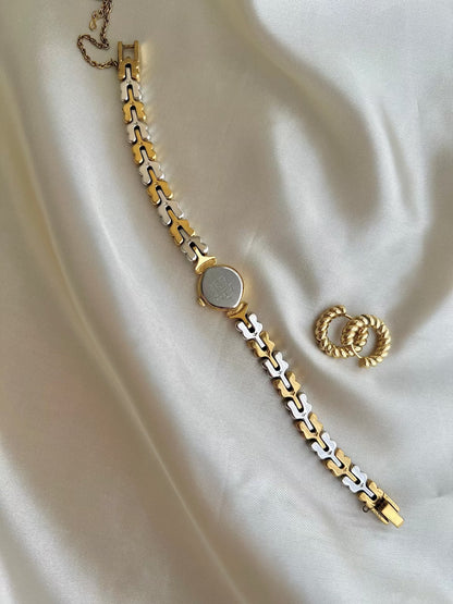 Seiko Champagne Dial Tear Drop Watch with Two-Tone Leaf-Link Bracelet, caseback detail of a vintage women's watch at Gilded Hour.