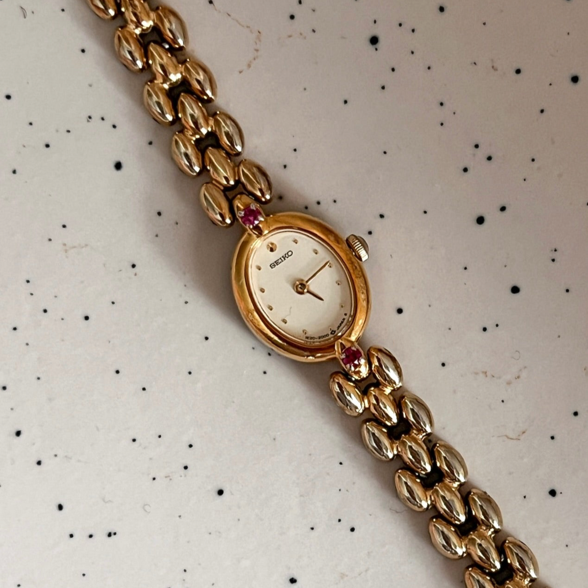 Seiko Tissé Ruby Accent Rice Bracelet Women’s Watch featuring champagne dial and rice bracelet; vintage watch product image 2.