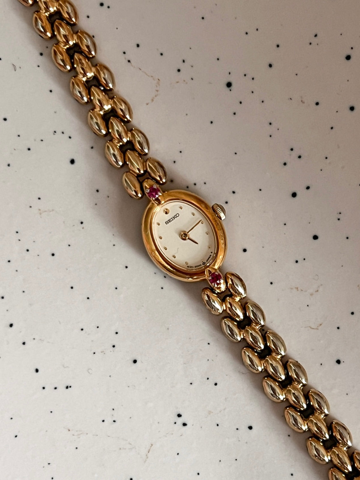 Seiko Tissé Ruby Accent Rice Bracelet Women’s Watch featuring champagne dial and rice bracelet; vintage watch product image 3.