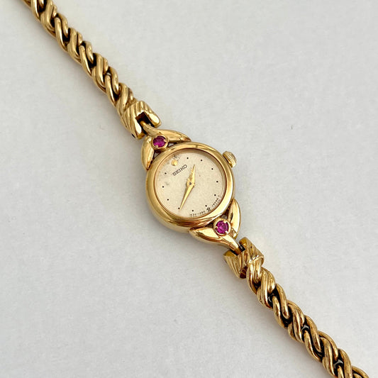 Seiko Tissé Ruby Accent Rope Bracelet Women’s Watch, dial close up of a vintage women's watch at Gilded Hour.
