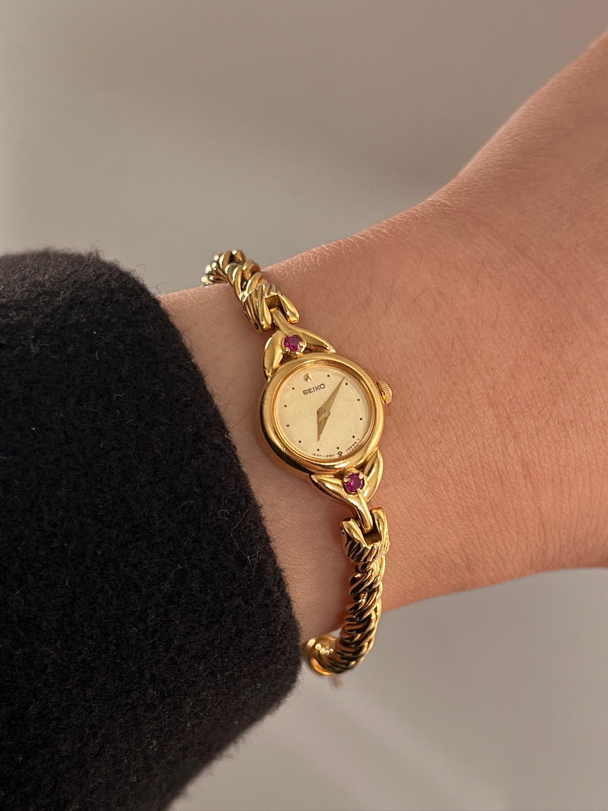 Seiko Tissé Ruby Accent Rope Bracelet Women’s Watch featuring champagne dial and rope bracelet; vintage watch product image 2.