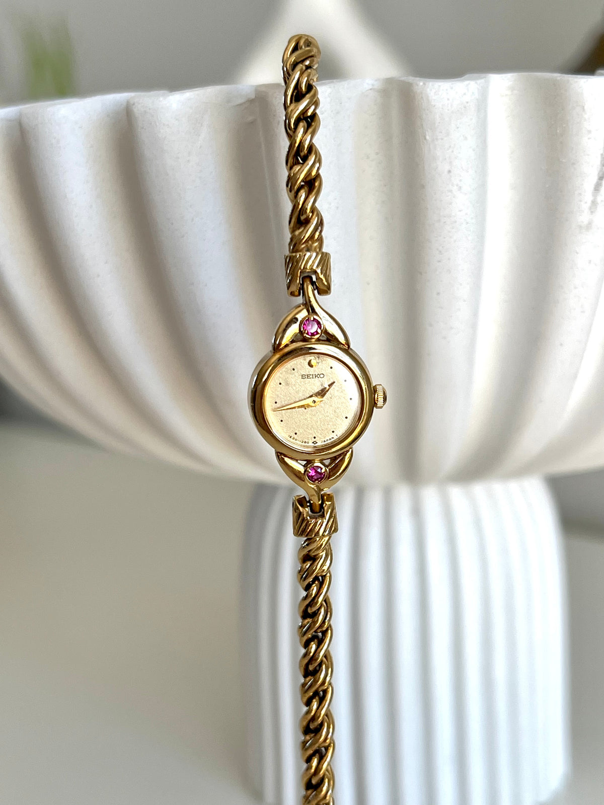 Seiko Tissé Ruby Accent Rope Bracelet Women’s Watch, angled view of a vintage women's watch at Gilded Hour.