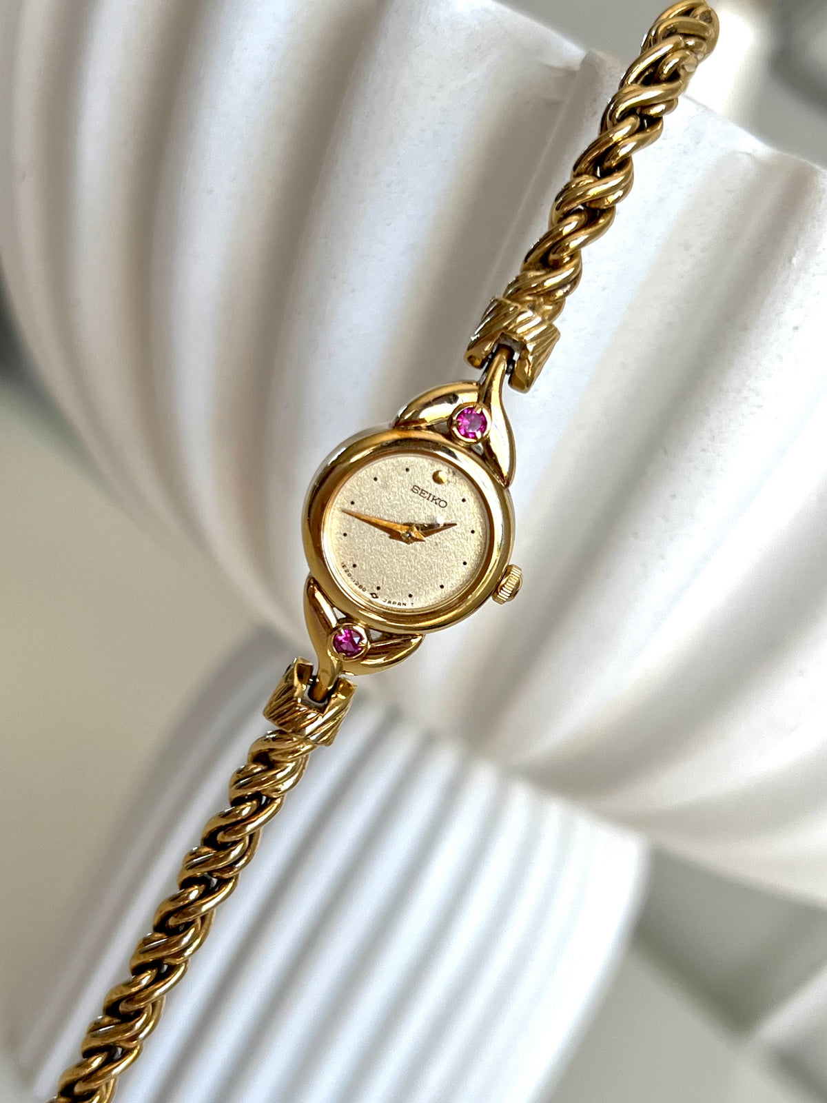Seiko Tissé Ruby Accent Rope Bracelet Women’s Watch, wrist shot of a vintage women's watch at Gilded Hour.