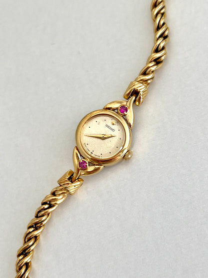 Seiko Tissé Ruby Accent Rope Bracelet Women’s Watch, bracelet detail of a vintage women's watch at Gilded Hour.
