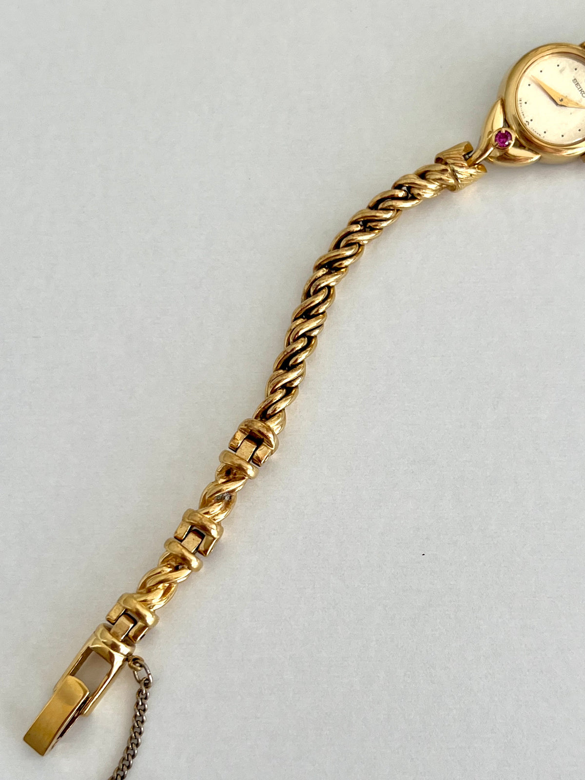 Seiko Tissé Ruby Accent Rope Bracelet Women’s Watch, caseback detail of a vintage women's watch at Gilded Hour.