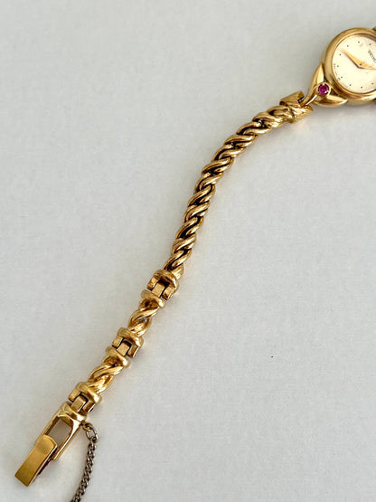 Seiko Tissé Ruby Accent Rope Bracelet Women’s Watch, caseback detail of a vintage women's watch at Gilded Hour.