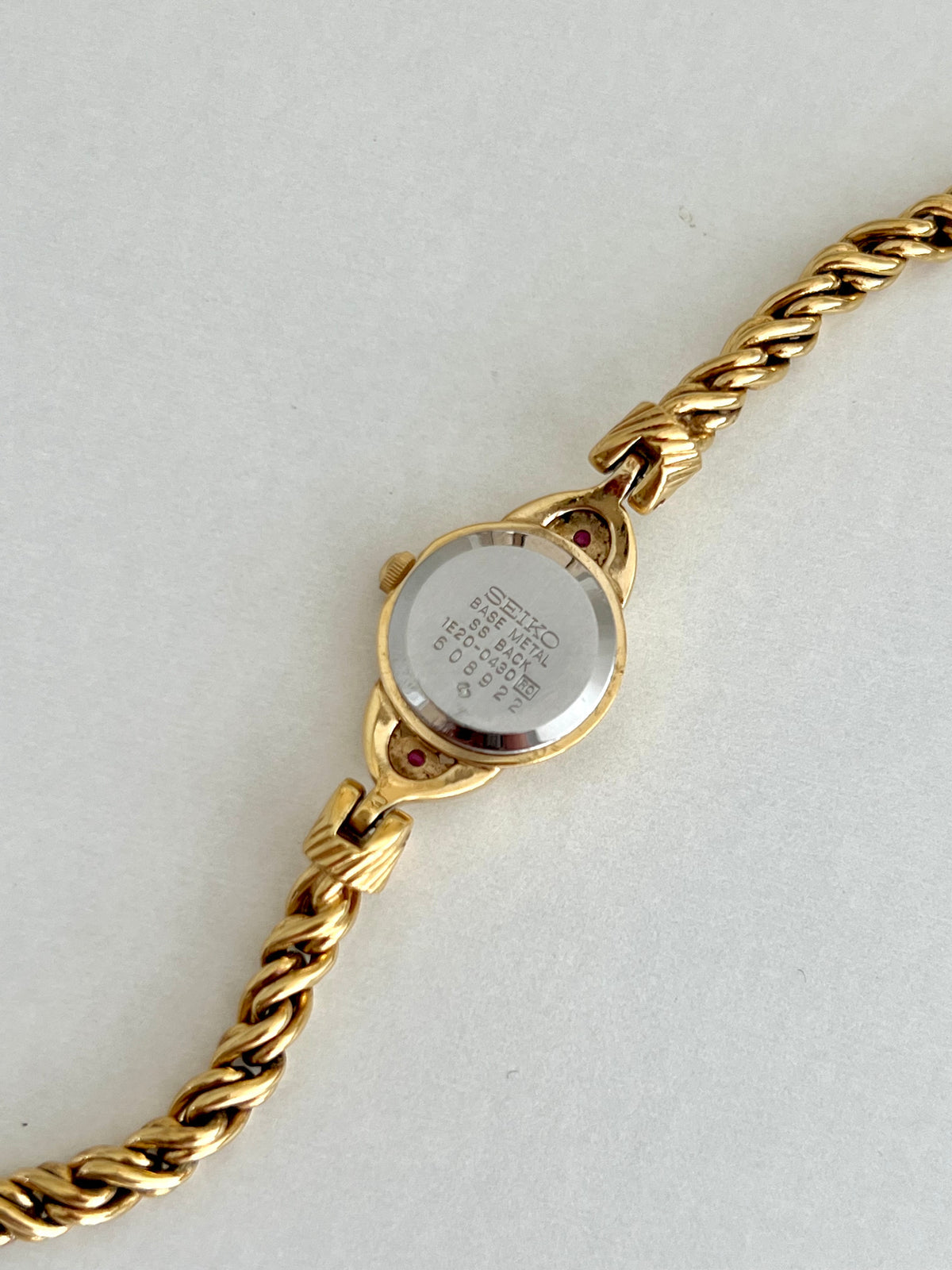 Seiko Tissé Ruby Accent Rope Bracelet Women’s Watch, front view of a vintage women's watch at Gilded Hour.