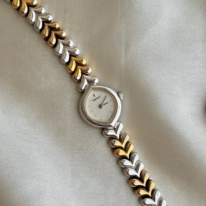 Seiko Silver Teardrop Women’s Watch with Two Tone Leaf Bracelet — dial and two tone leaf link bracelet.