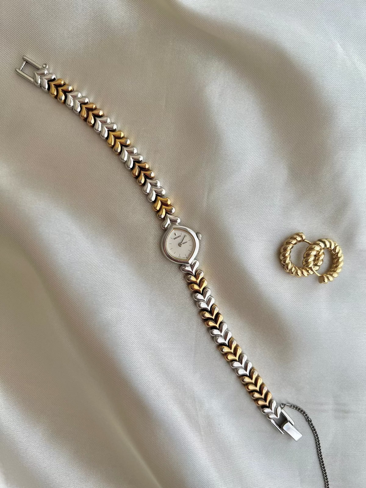Seiko Silver Teardrop Women’s Watch with Two Tone Leaf Bracelet — full watch with bracelet clasp.