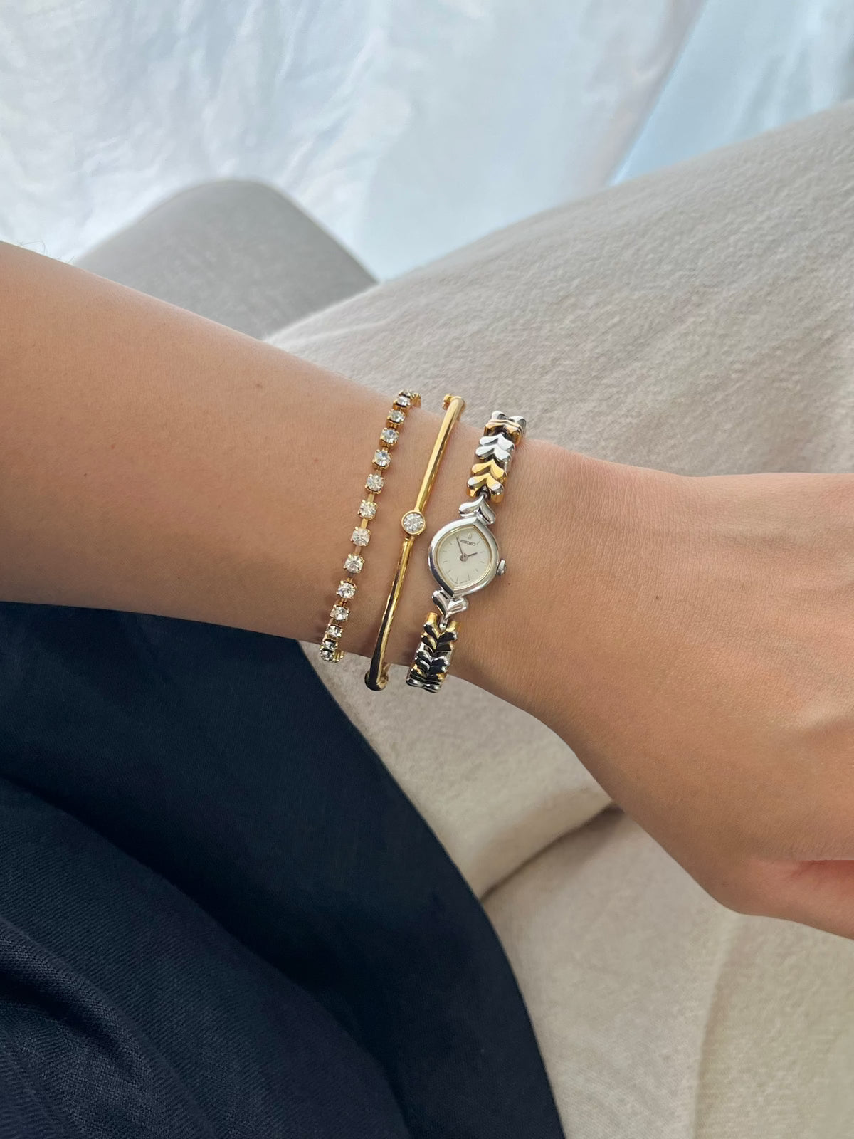 Seiko Silver Teardrop Women’s Watch with Two Tone Leaf Bracelet — watch worn on the wrist.