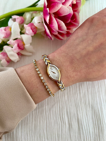 Front view of the Seiko Tisse teardrop watch with white dial.