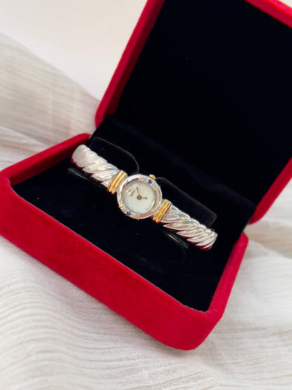 Seiko Bangle Woman's Watch – Two-Tone with Sapphire and Diamond Accents — the watch shown from another angle.