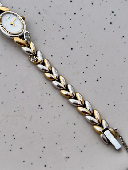 Detail of the Seiko two-tone leaf bracelet with embedded gemstones.