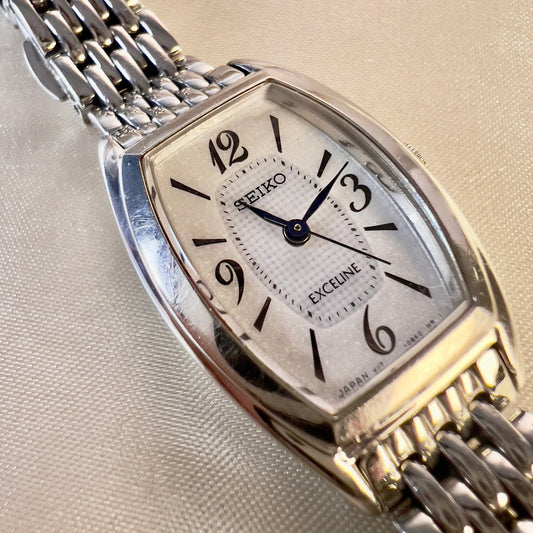 Seiko Exceline Tank women’s watch with a multi-faceted dial, applied markers, and linking bracelet.