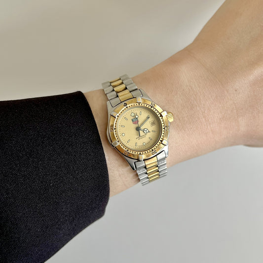 TAG Heuer 2000 Professional 964.008 two-tone women’s watch with champagne dial worn on the wrist
