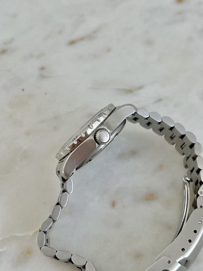 Side profile of TAG Heuer 2000 Professional showing signed crown and case