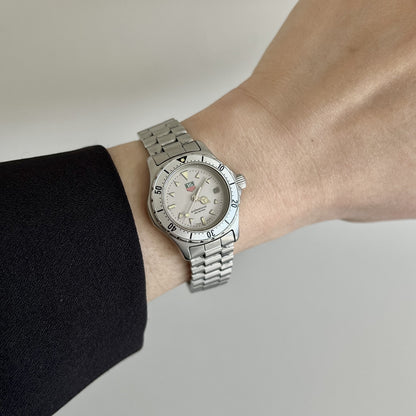 TAG Heuer 2000 Professional WE1412-2 stainless steel women’s watch with silver dial worn on the wrist