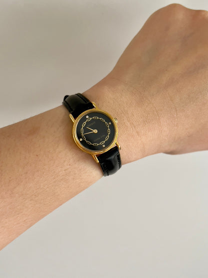 Tissot Chaîne d’Or Black Dial Chain Motif Women’s Watch; black stitched leather strap and gold tone buckle. Product photograph 2 of 10.
