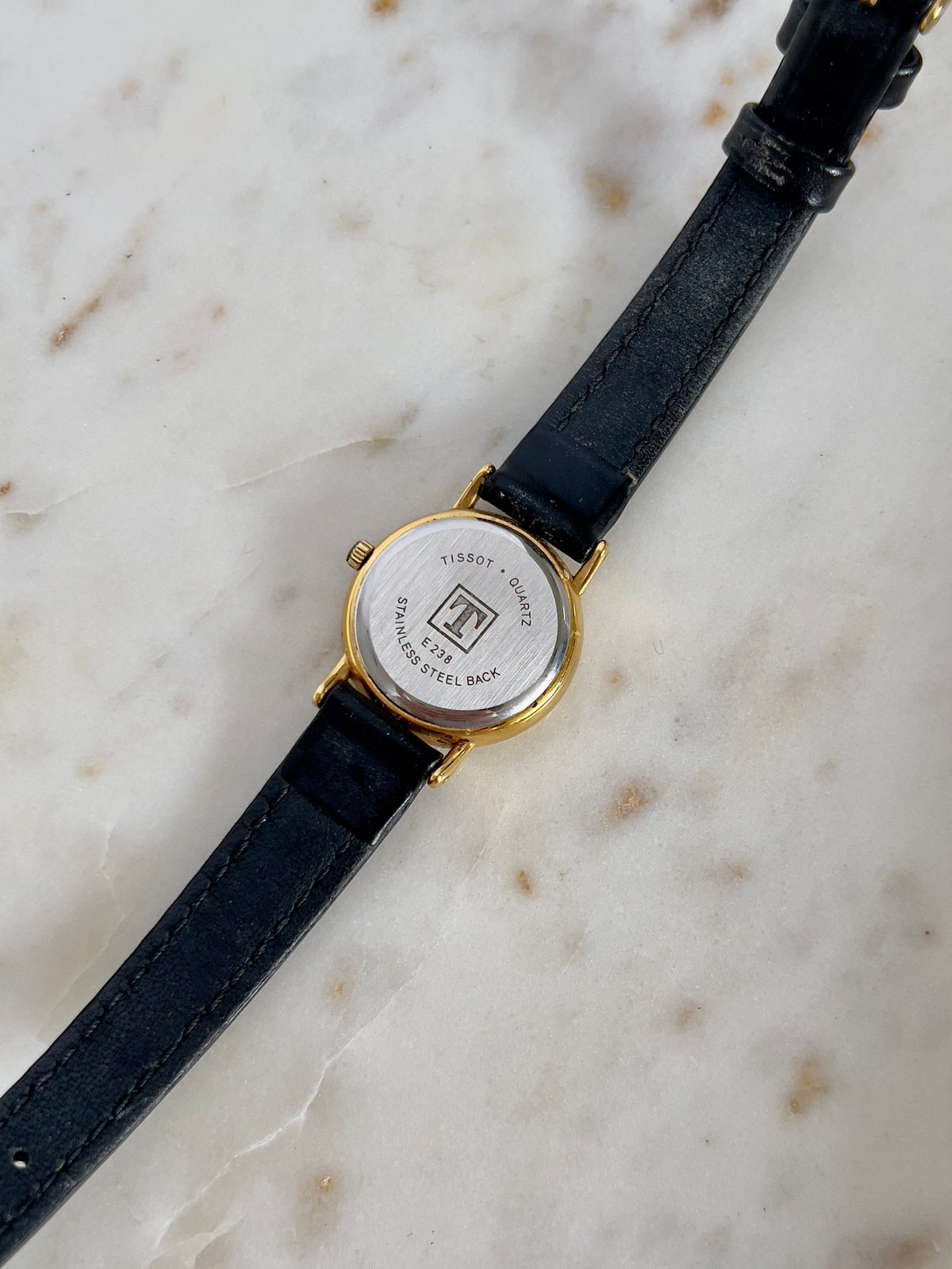 Tissot Chaîne d’Or Black Dial Chain Motif Women’s Watch; black stitched leather strap and gold tone buckle. Product photograph 3 of 10.