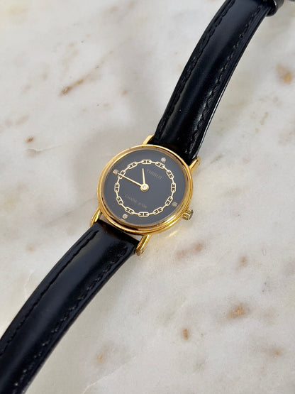 Tissot Chaîne d’Or Black Dial Chain Motif Women’s Watch; black stitched leather strap and gold tone buckle. Product photograph 9 of 10.