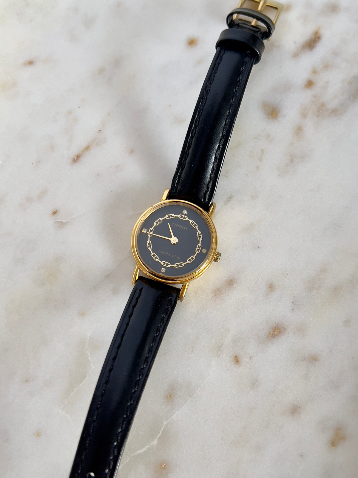 Tissot Chaîne d’Or Black Dial Chain Motif Women’s Watch; black stitched leather strap and gold tone buckle. Product photograph 10 of 10.