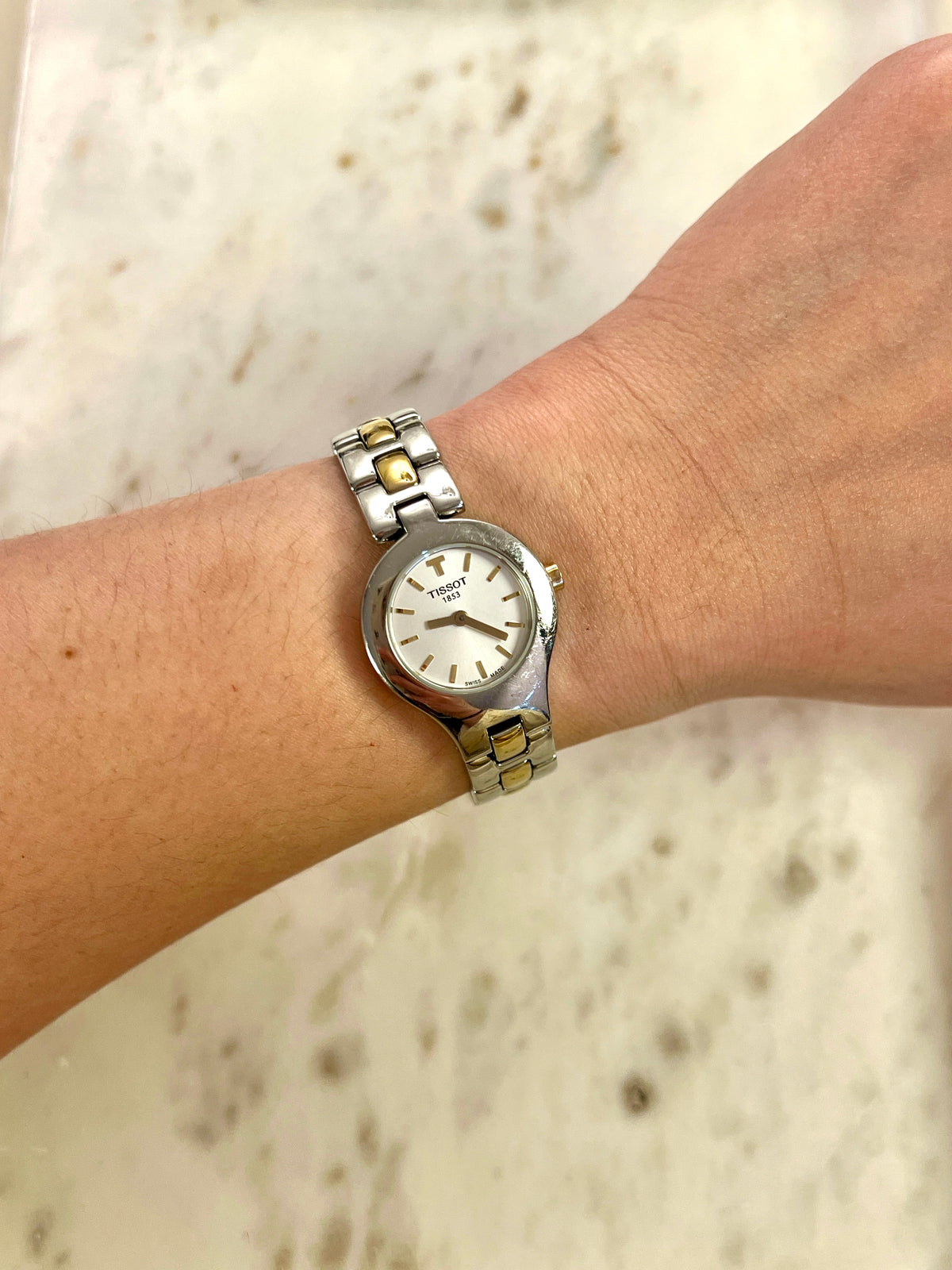 Tissot White Dial Two Tone Bracelet Women’s Watch; two tone bracelet with broad silver tone links and gold tone connectors. Product photograph 3 of 11.