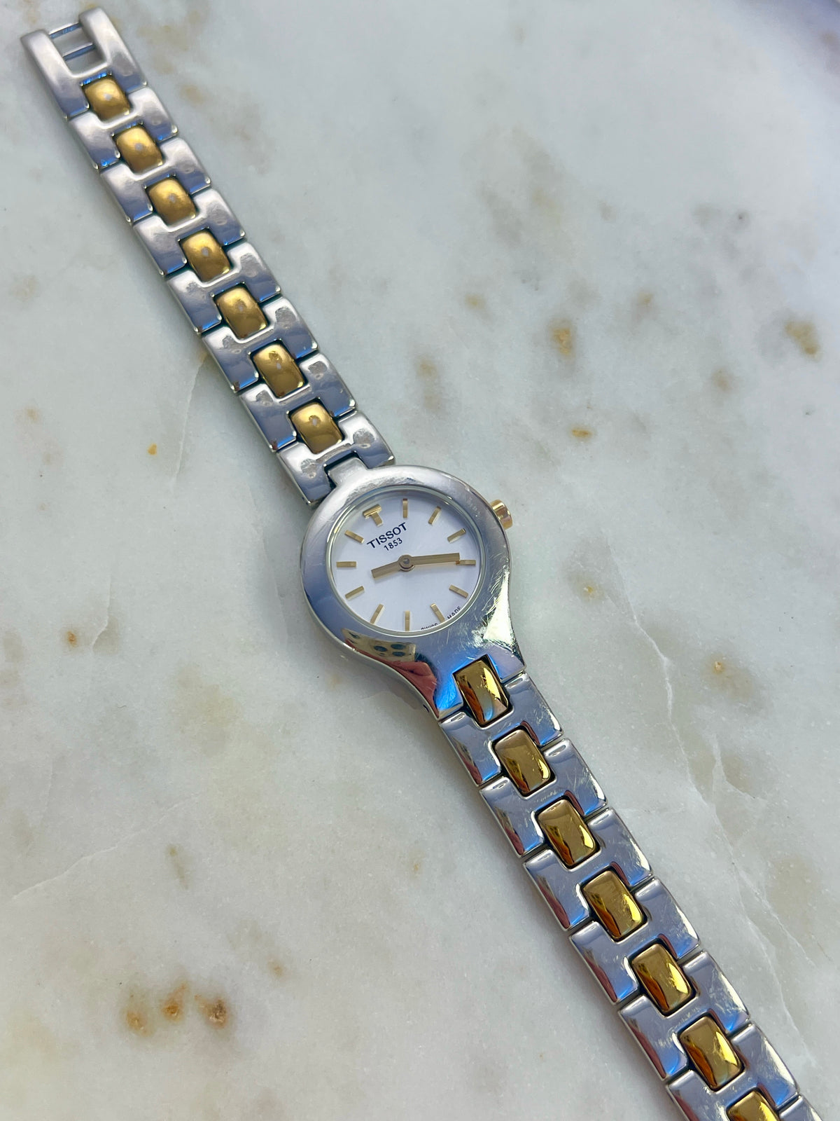 Tissot White Dial Two Tone Bracelet Women’s Watch; two tone bracelet with broad silver tone links and gold tone connectors. Product photograph 6 of 11.