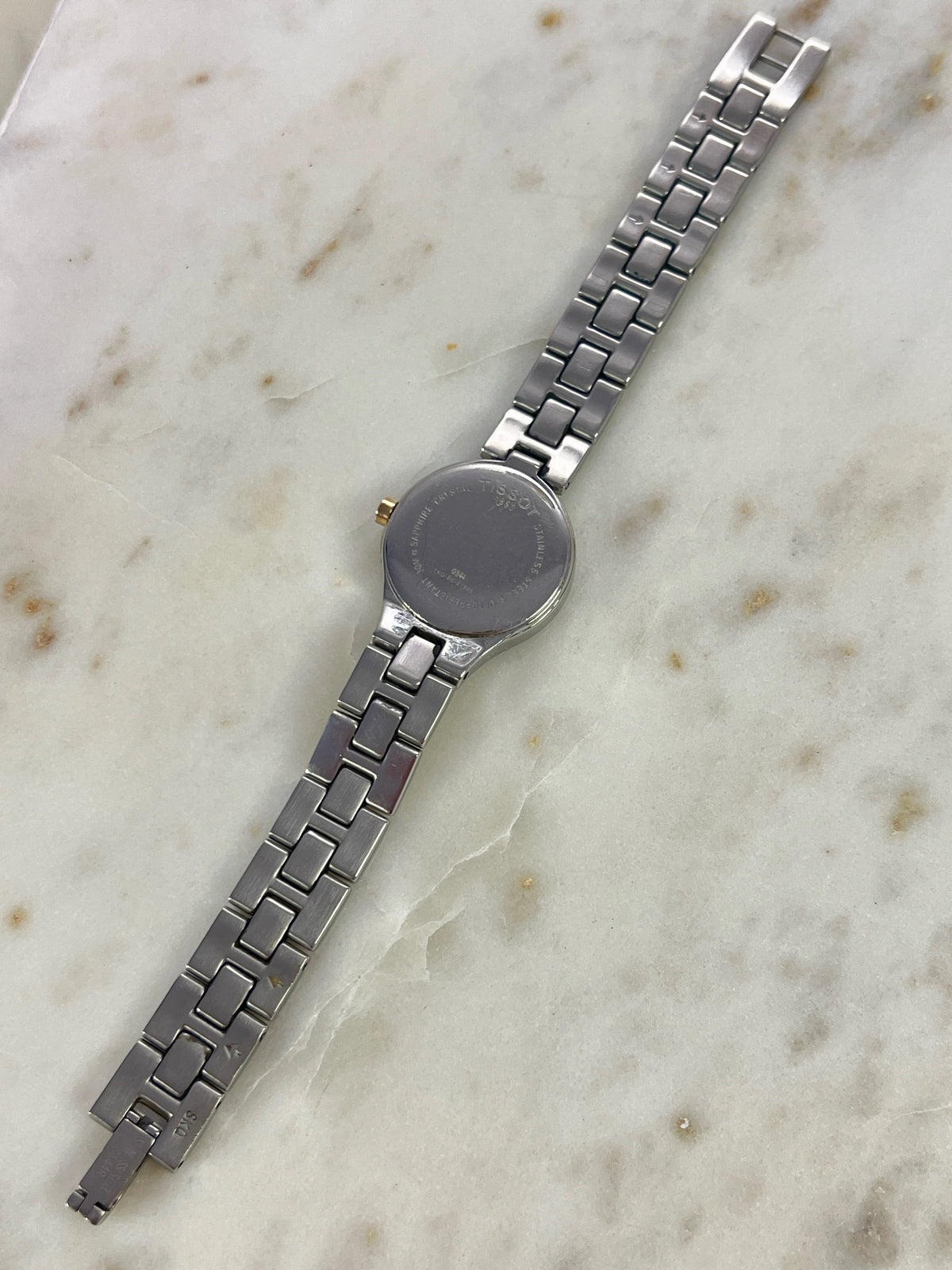 Tissot White Dial Two Tone Bracelet Women’s Watch; two tone bracelet with broad silver tone links and gold tone connectors. Product photograph 7 of 11.