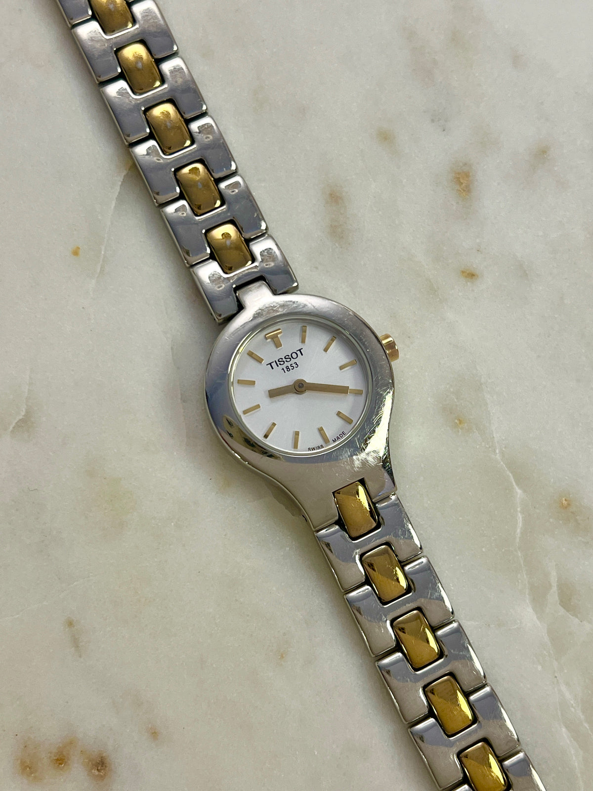 Tissot White Dial Two Tone Bracelet Women’s Watch; two tone bracelet with broad silver tone links and gold tone connectors. Product photograph 11 of 11.
