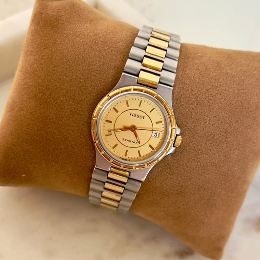 Tissot Seastar Two-Tone Watch with Sunburst Gold Dial and Date, case profile of a vintage women's watch at Gilded Hour.