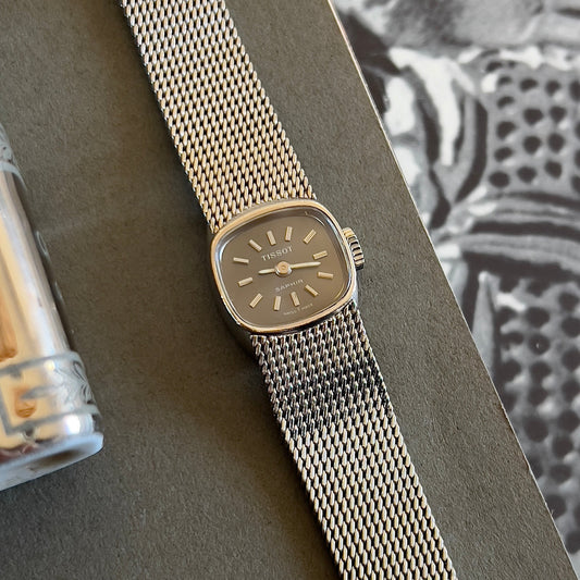 Tissot Black Dial Petite Woman's Watch, case profile of a vintage women's watch at Gilded Hour.