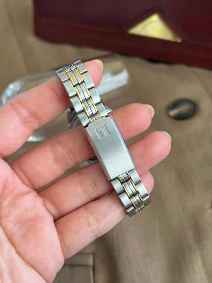 Tissot signed brushed steel deployant clasp and two tone bracelet links