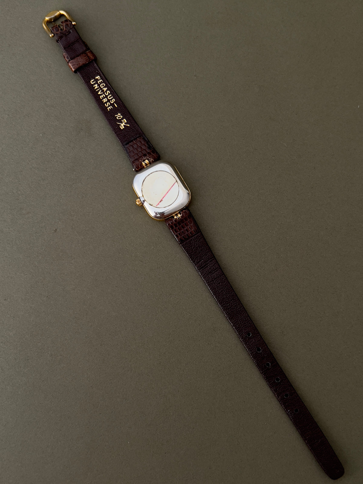 Tissot Stylist Gold Cushion Women’s Watch with Patterned Dial — caseback and inside of leather strap.
